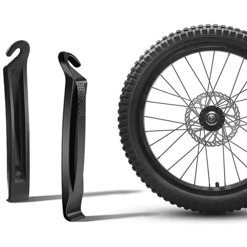 2 leviers noirs debout à côté d'une roue VTT — vue identique image 3