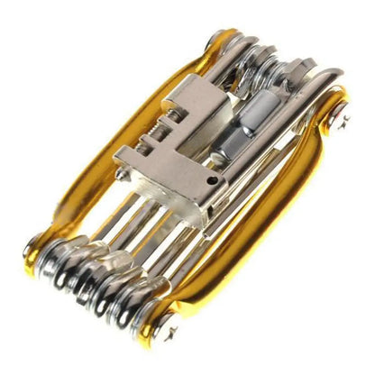 Outil 11-en-1 doré replié — vue rapprochée du module coupe-chaîne et axe de rivet