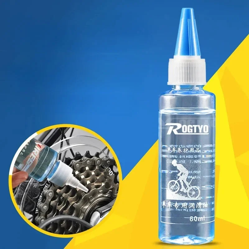 Flacon Rogtyo 60ml sur fond bleu/jaune avec incrustration de l'application d'huile sur cassette vélo